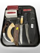 A group of Swiss Army Knives, hunting knife with antler handle, diver's knife, etc.