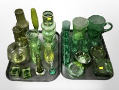 A collection of green glass ware.