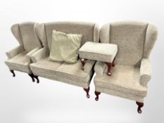 A contemporary four-piece lounge suite comprising of two-seater wingback settee,