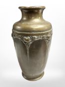 An Arts and Crafts brass vase, height 27cm.