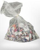 A large quantity of Pokemon and football trading cards in sealed bag