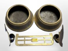 Two brass bowls, a pair of boot ornaments and a trivet.