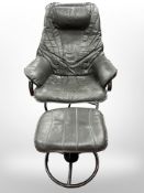 A Danish black leather metal tubular-framed swivel armchair with matching footstool, width 72cm.