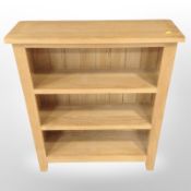 A contemporary oak open bookcase, 70cm wide x 22cm deep x 82cm high.