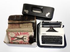 An Erika typewriter, together with a Victorian family Bible and other volumes, sheet music,