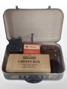 A vintage python suitcase containing bakelite Viewmasters, Eumig C3 camera, etc.