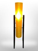 A 1970s rocket lamp on ebonised legs, height 113cm.