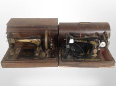Three Singer hand/electric sewing machines, in boxes.