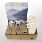 A quantity of new ceramic mugs, Curver plastic twin-handled baskets, wall canvases.