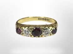 An 18ct yellow gold ruby and diamond ring, size N. CONDITION REPORT: 4.1g.