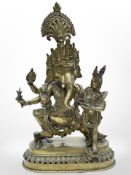 A late-19th/early-20th century Indian brass figure group of Ganesh and Shiva, height 29.5cm.