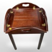 A mahogany butler's tray table, 60cm wide.