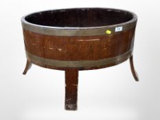 A Victorian brass-bound cellarette in the George III style on splayed legs,