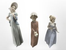 Three Nao figures of girls, all boxed.