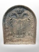 A 19th-century cast-iron fire back, 54cm x 47cm.