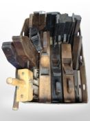 A collection of antique woodworking planes, braces, etc.