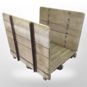 A 19th-century teak and cast-iron goods trolley, 110cm long x 100cm wide x 100cm high.