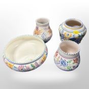 Four pieces of Poole pottery.