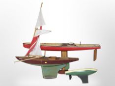 Three large model pond yachts, largest 126cm long.