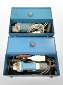 Two Makita disc grinders in cases.