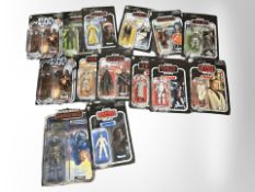 14 Kenner Star Wars figurines including The Mandalorian, The Empire Strikes Back,