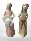 Two Lladró figures of girls wearing summer dresses, Numbers 5008 and 5010, both boxed.