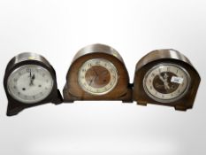 A Smiths Bakelite-cased eight-day mantel clock, a further Smiths oak clock, and one other,