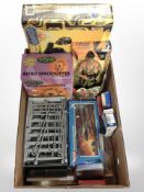 An Action Man figure, Space Hopper, Walkie-Talkie radio, playing cards, die-cast vehicle, etc.