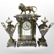 A 19th-century French portico marble eight-day mantel clock garniture surmounted by a lion,