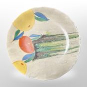 A Clarice Cliff for Wilkinson Ltd scalloped-edge plate decorated with fruit, diameter 20cm.