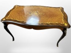 An Italian-style inlaid shaped-top occasional table on cabriole legs,