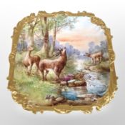 A French square hand-painted porcelain dish depicting deer by a stream, width 36cm.