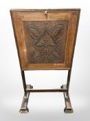 A Victorian oak folding writing stand, height 110cm.