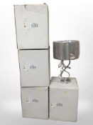 A quantity of new chrome-finished table lamps.