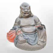 An oriental export lacquered papier-mâche figure of a seated Buddha, height 13cm.