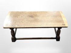 A carved oak refectory coffee table, length 104cm.
