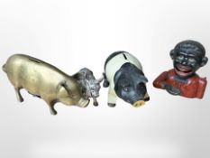 Three cast-iron/brass money boxes.