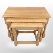 A contemporary pine nest of three tables, width 73cm.