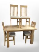 A contemporary pine-effect rectangular dining table, length 135cm,