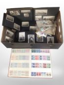 A collection of stamps and postcard albums.