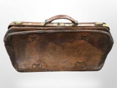 An antique leather doctor's bag, width 65cm.