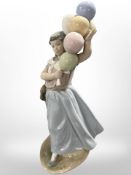 A Lladró figure of a girl holding balloons, No. 5141, boxed.