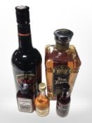 A bottle of QC cream wine, a further bottle of Five Rings Very Old Reserve Cyprus Brandy,