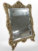 An ornate gilt brass easel mirror, height 33cm.