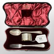 A cased silver fork, spoon and napkin ring in Walker & Hall box.