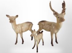 Three Beswick deer, tallest 20cm.