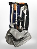 Two folding scooters in carry bags.