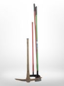 A vintage pickaxe and three further modern garden tools.