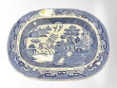 A blue and white transfer-printed willow pattern meat plate, width 46cm.