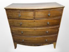 A late-Victorian mahogany bow-front five-drawer chest in the Regency style,